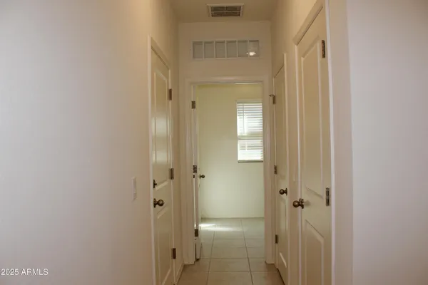a view of a bathroom from a hallway