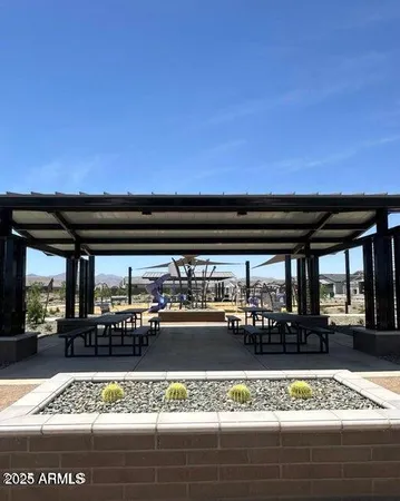 a view of a patio with a table and chairs