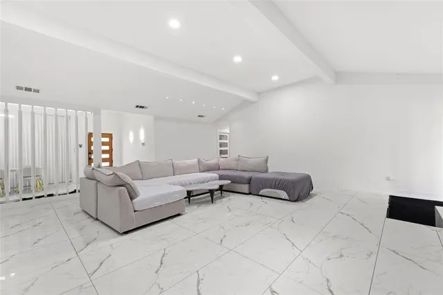 a living room with furniture and a couch