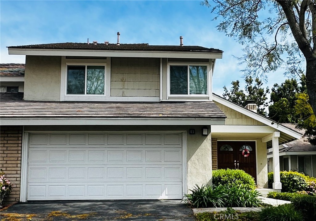 5 Glenhurst, Unit 5 Irvine, CA 92604 - Photo 1 of 16 a view of a house with a small yard