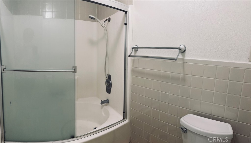 5 Glenhurst, Unit 5 Irvine, CA 92604 - Photo 15 of 16 a bathroom with a shower and a toilet