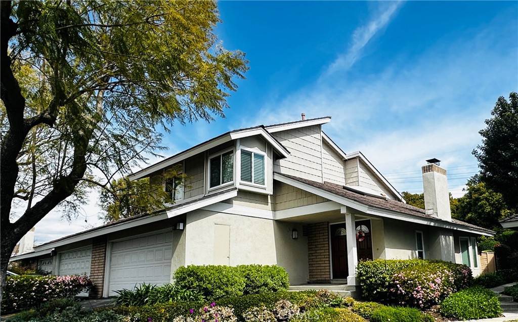 5 Glenhurst, Unit 5 Irvine, CA 92604 - Photo 2 of 16 a front view of a house with garden