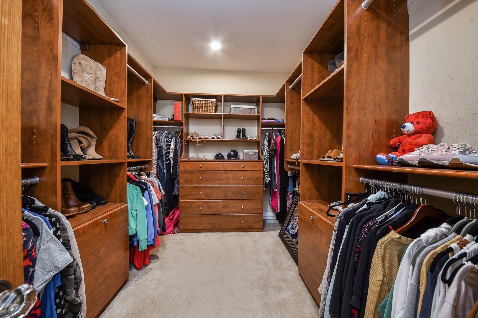 821 Wellner Road Naperville, IL 60540 - Photo 25 of 56 a view of walk in closet with clothes and shoes