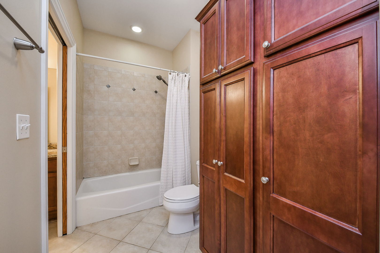 821 Wellner Road Naperville, IL 60540 - Photo 31 of 56 a bathroom with a granite countertop bathtub shower sink vanity and toilet
