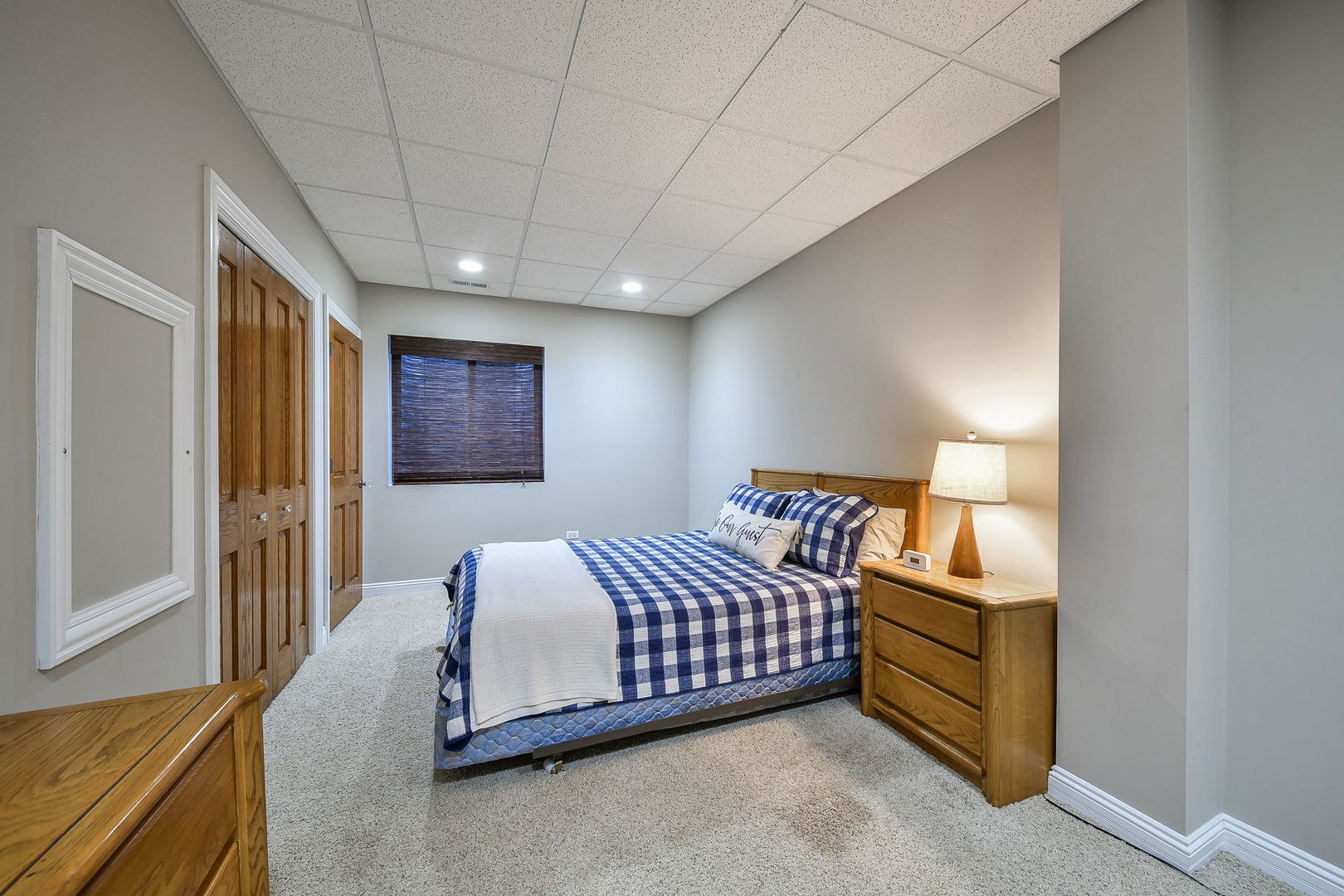 821 Wellner Road Naperville, IL 60540 - Photo 36 of 56 a spacious bedroom with a bed and a dresser