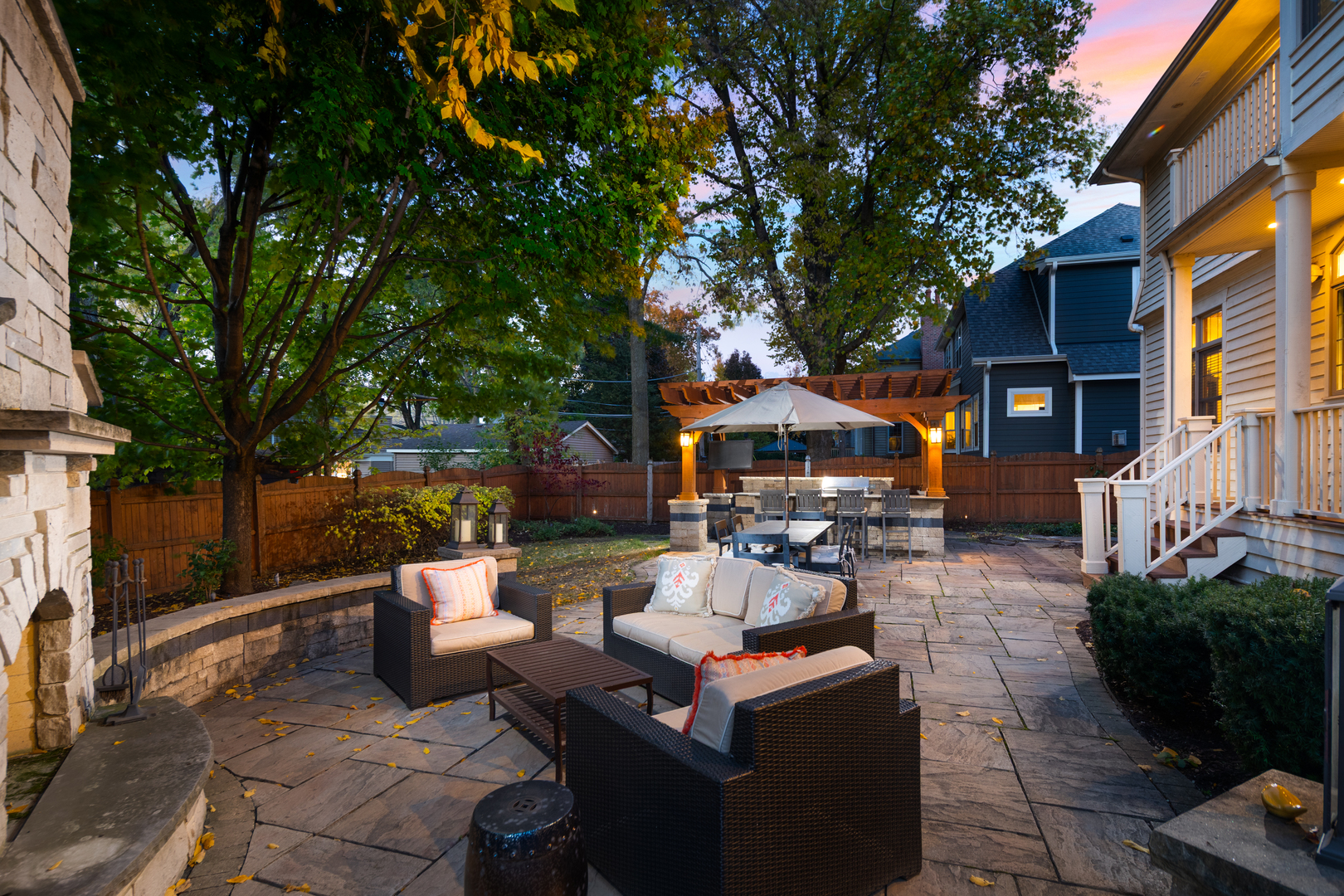 821 Wellner Road Naperville, IL 60540 - Photo 44 of 56 a view of a patio with couches and a fire pit and a fire pit