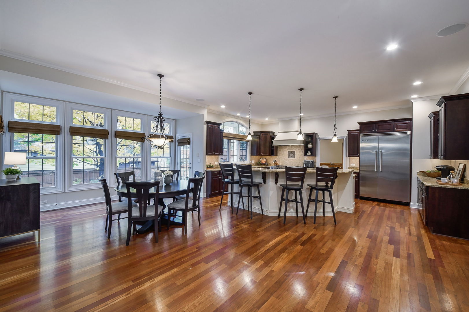 821 Wellner Road Naperville, IL 60540 - Photo 5 of 56 a view of a dining room with furniture window and wooden floor