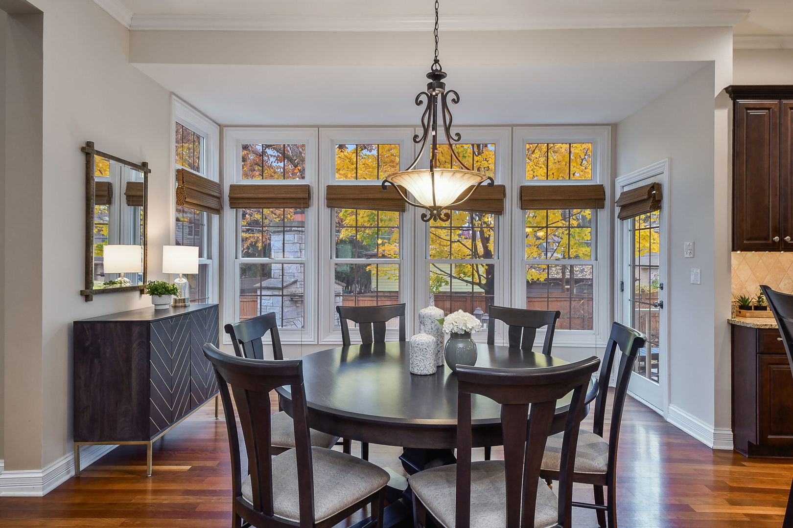 821 Wellner Road Naperville, IL 60540 - Photo 6 of 56 a view of a dining room with furniture window and wooden floor