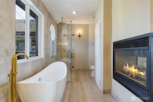 a bathroom with a tub and a shower