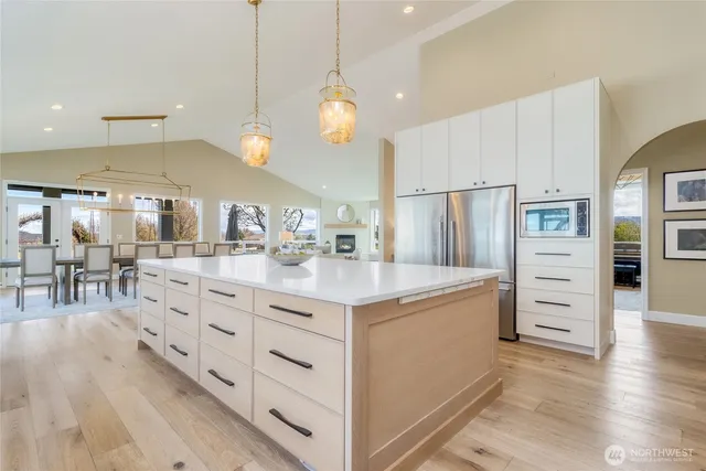 a kitchen with counter top space cabinets and stainless steel appliances