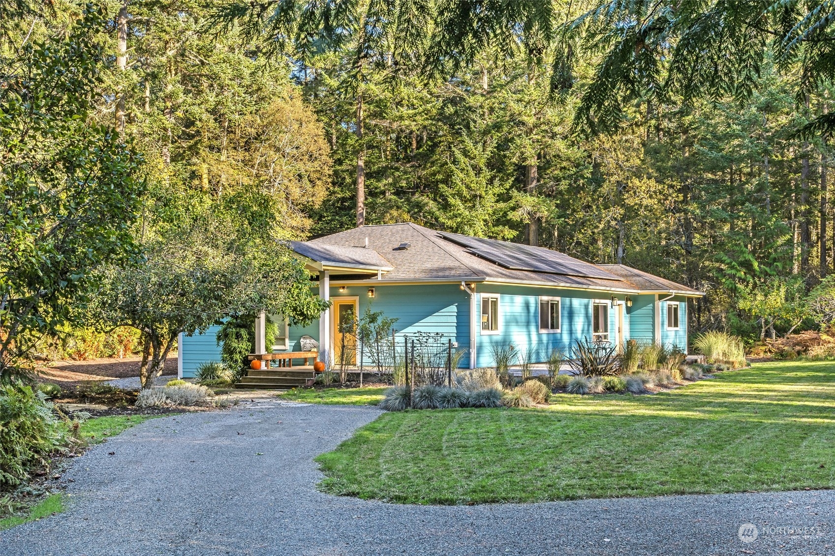 150 Carter Beach Road Friday Harbor, WA 98250 - Photo 1 of 39 a front view of a house with garden