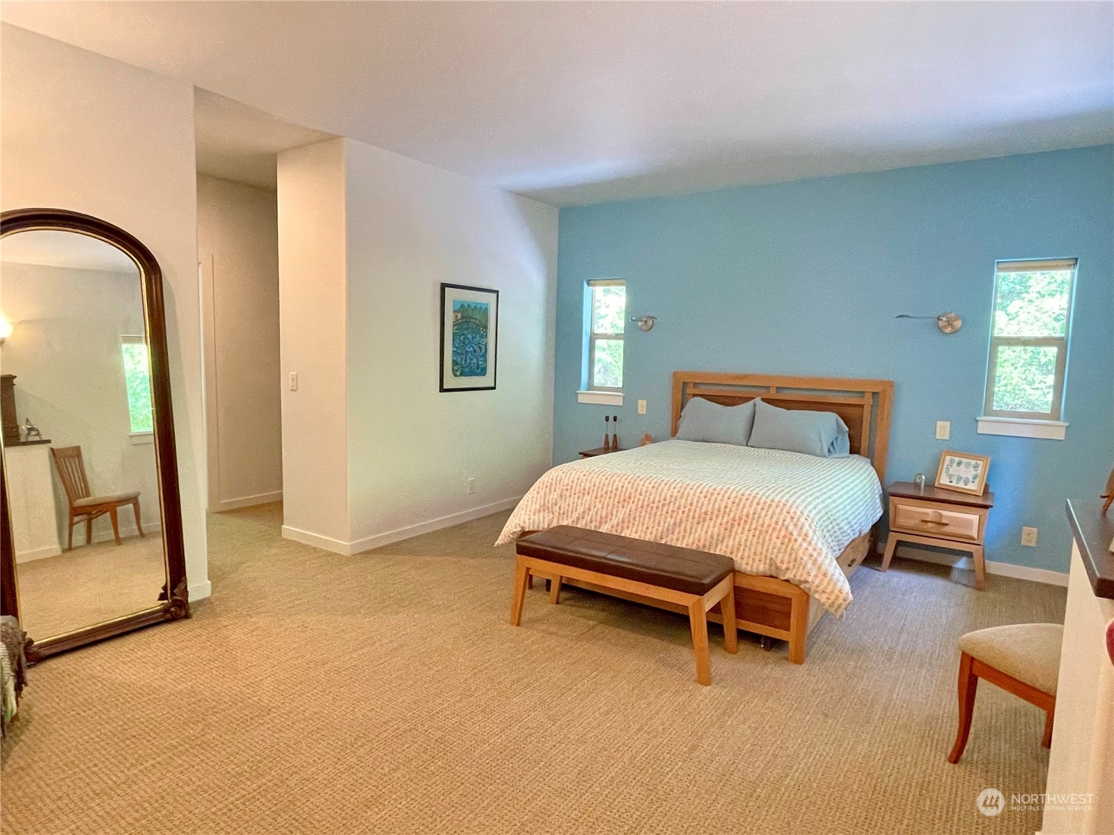 150 Carter Beach Road Friday Harbor, WA 98250 - Photo 24 of 39 a bedroom with a bed and a mirror