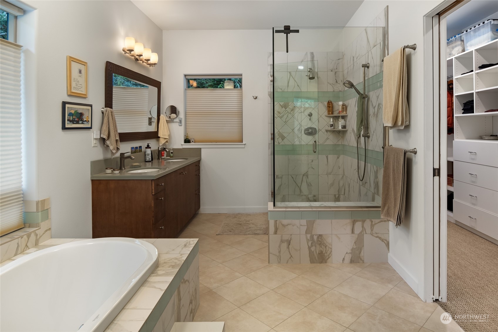 150 Carter Beach Road Friday Harbor, WA 98250 - Photo 26 of 39 a bathroom with a granite countertop sink a toilet a mirror and shower