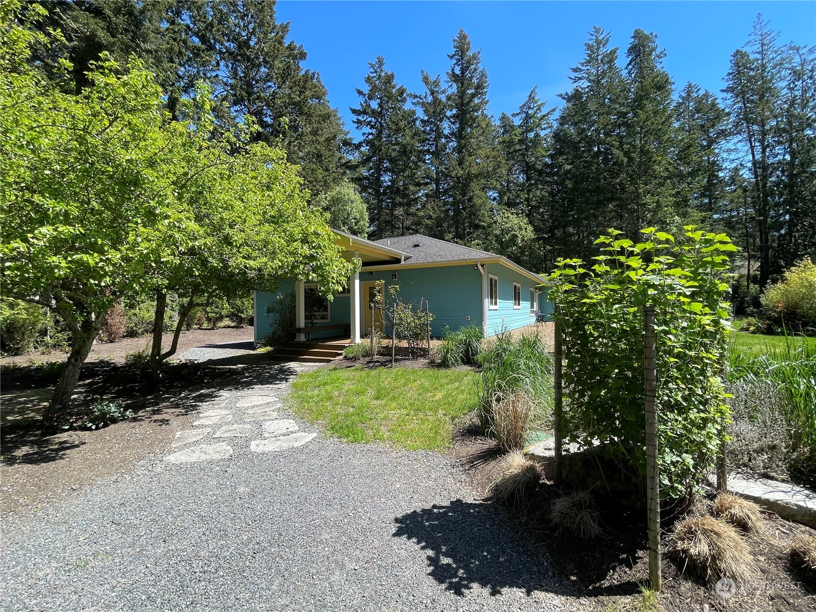 150 Carter Beach Road Friday Harbor, WA 98250 - Photo 8 of 39 a view of a house with backyard and garden