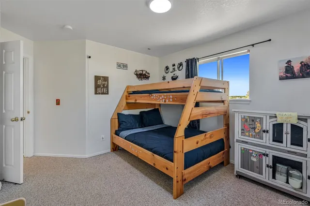 a bedroom with bed and a closet