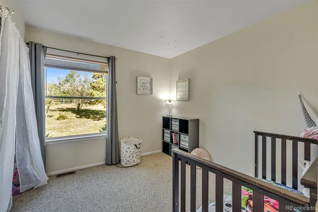 a view of livingroom with furniture and front door