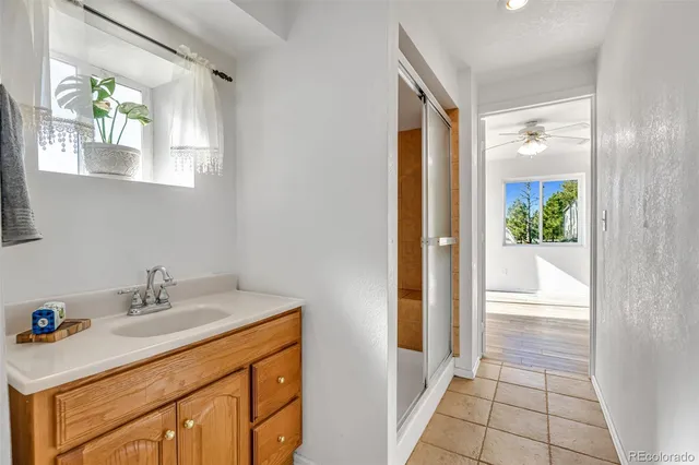 a bedroom with a bed and a mirror