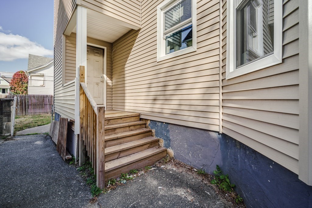 38 Acushnet Avenue Springfield, MA 01105 - Photo 3 of 33 a view of a house with wooden fence