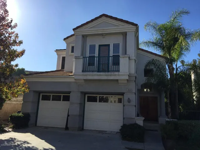 front view of a house with a small yard