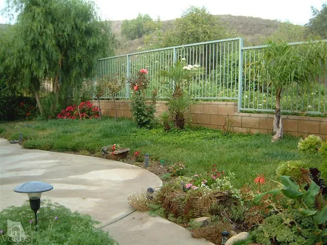 a garden view with a playing court