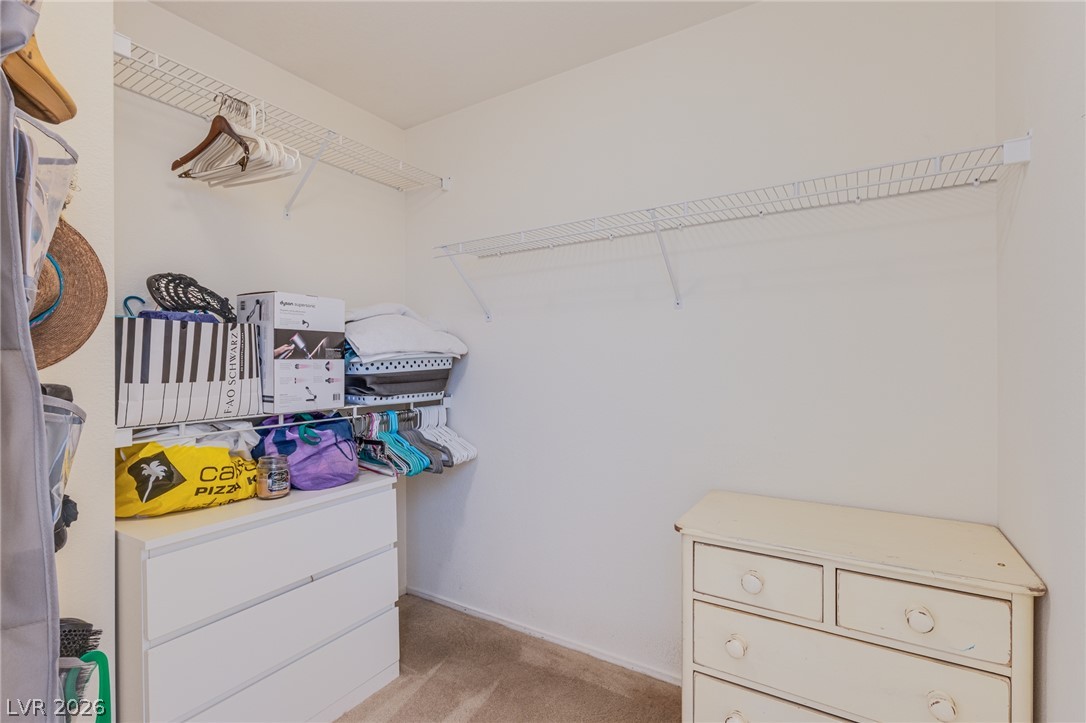 253 Camelback Ridge Avenue Henderson, NV 89012 - Photo 20 of 26 A spacious walk-in closet includes wire shelving and soft carpeting.
