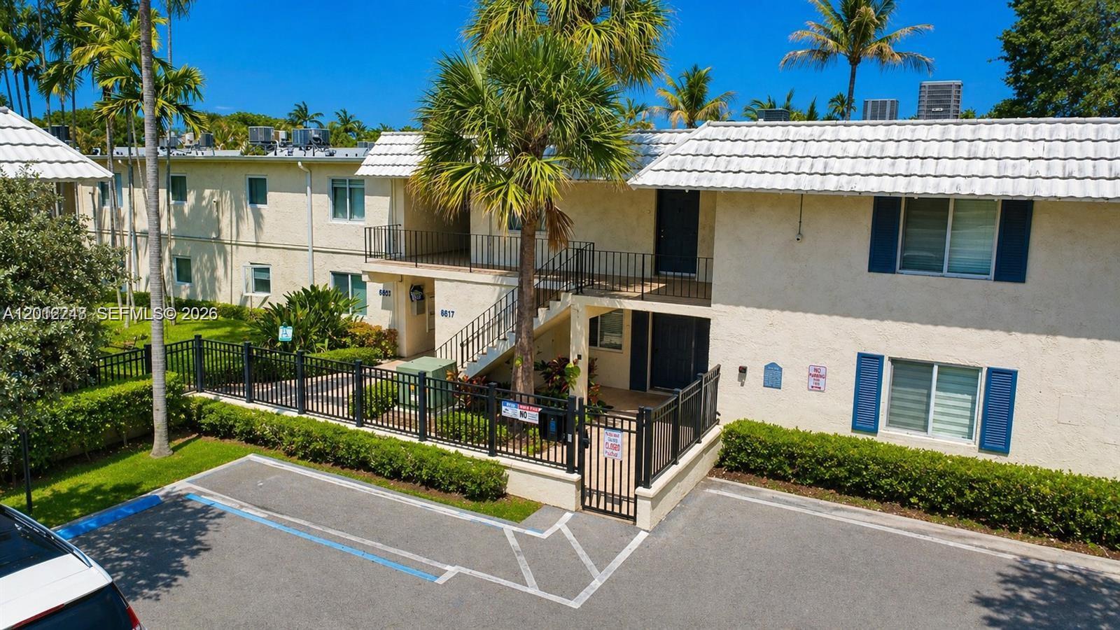 8609 Southwest 68th Court, Unit 22 Pinecrest, FL 33156 - Photo 14 of 15 a view of a house with a street