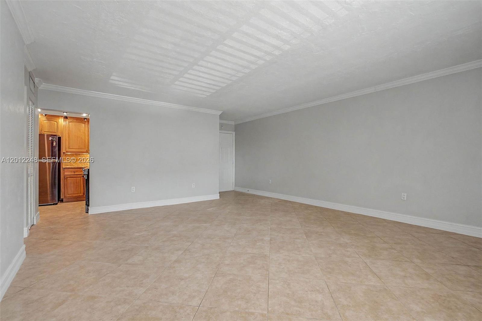 8609 Southwest 68th Court, Unit 22 Pinecrest, FL 33156 - Photo 2 of 15 a view of an empty room