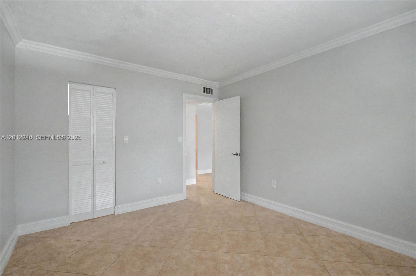 8609 Southwest 68th Court, Unit 22 Pinecrest, FL 33156 - Photo 9 of 15 a view of an empty room