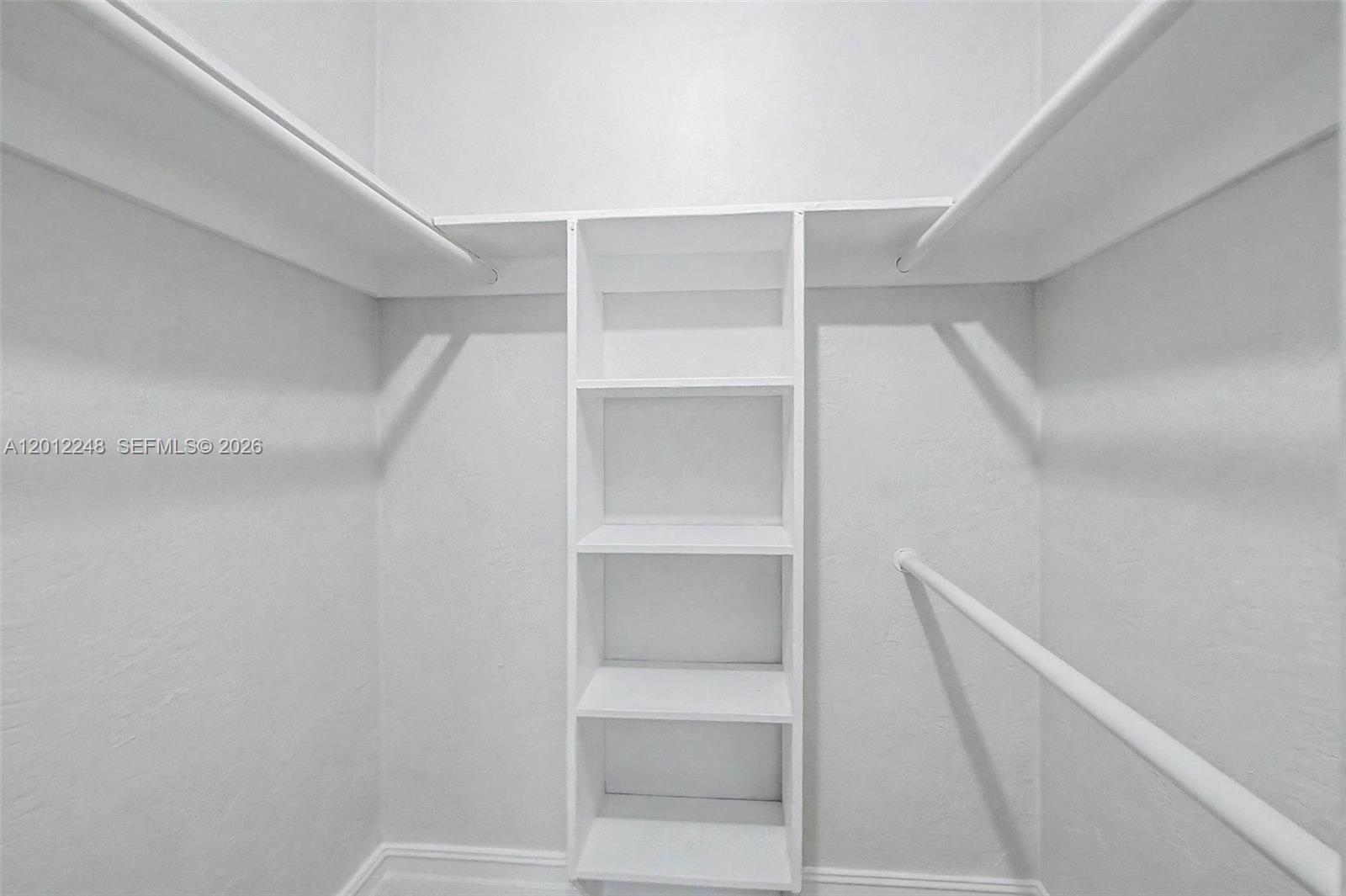 8609 Southwest 68th Court, Unit 22 Pinecrest, FL 33156 - Photo 10 of 15 a view of an empty walk in closet