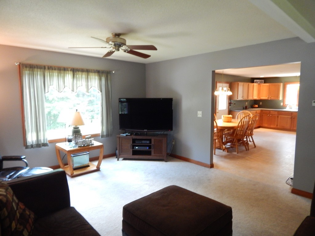 129 Boston Road Palmer, MA 01069 - Photo 11 of 23 a living room with furniture and a flat screen tv