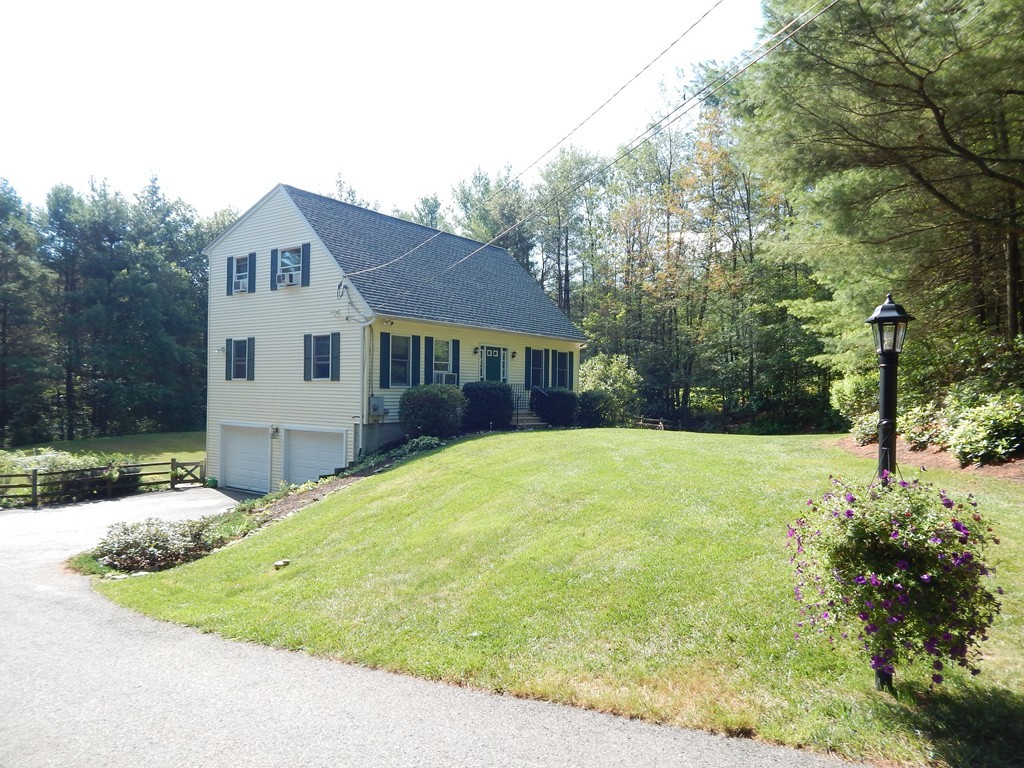 129 Boston Road Palmer, MA 01069 - Photo 3 of 23 a view of a house with a backyard