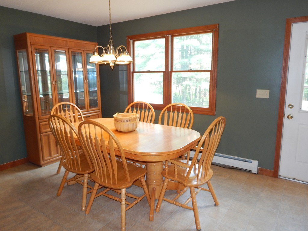 129 Boston Road Palmer, MA 01069 - Photo 5 of 23 a dining room with furniture a chandelier and window