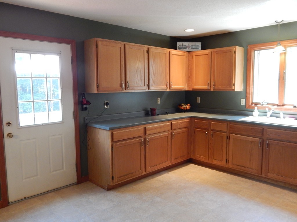 129 Boston Road Palmer, MA 01069 - Photo 8 of 23 a kitchen with stainless steel appliances granite countertop cabinets sink and window