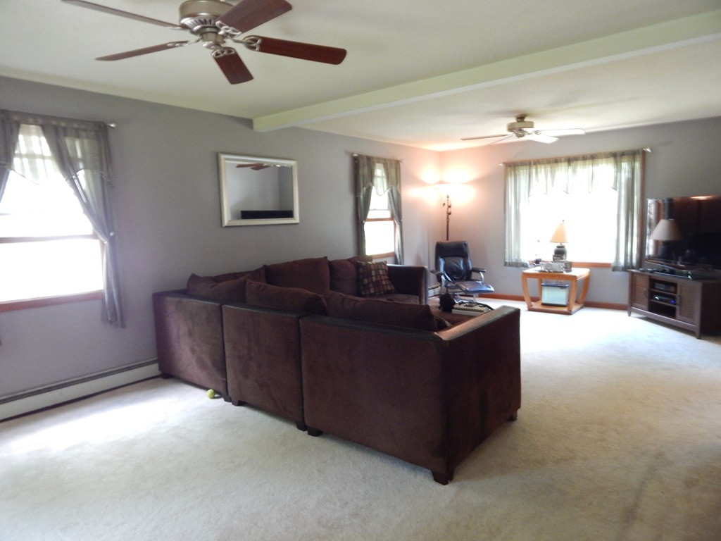 129 Boston Road Palmer, MA 01069 - Photo 10 of 23 a living room with furniture and a flat screen tv