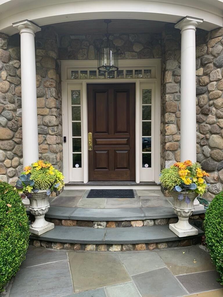 1629 Ponus Ridge Road New Canaan, CT 06840 - Photo 2 of 51 a house view with a outdoor space