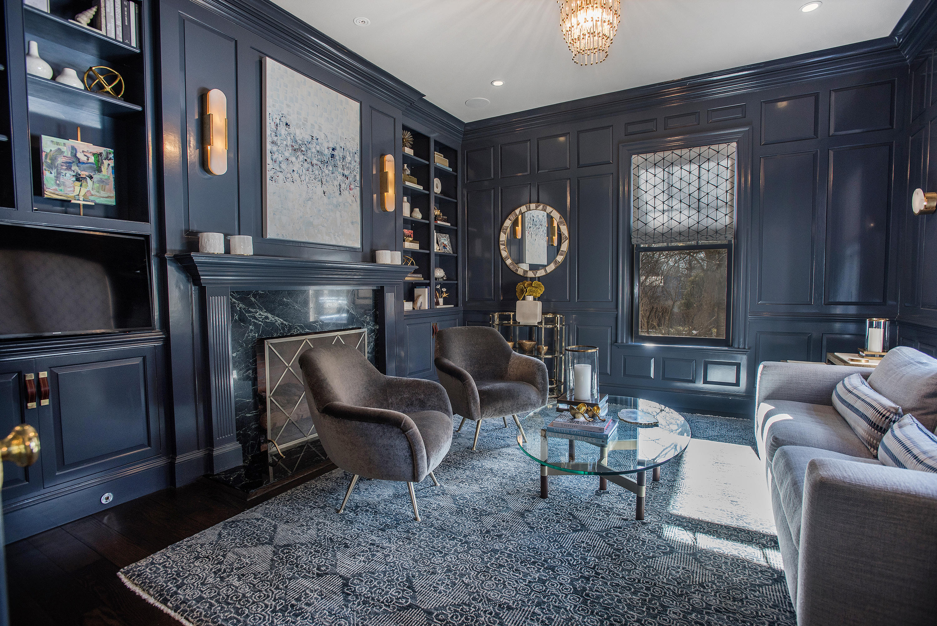1629 Ponus Ridge Road New Canaan, CT 06840 - Photo 12 of 51 a living room with furniture a rug and a fireplace
