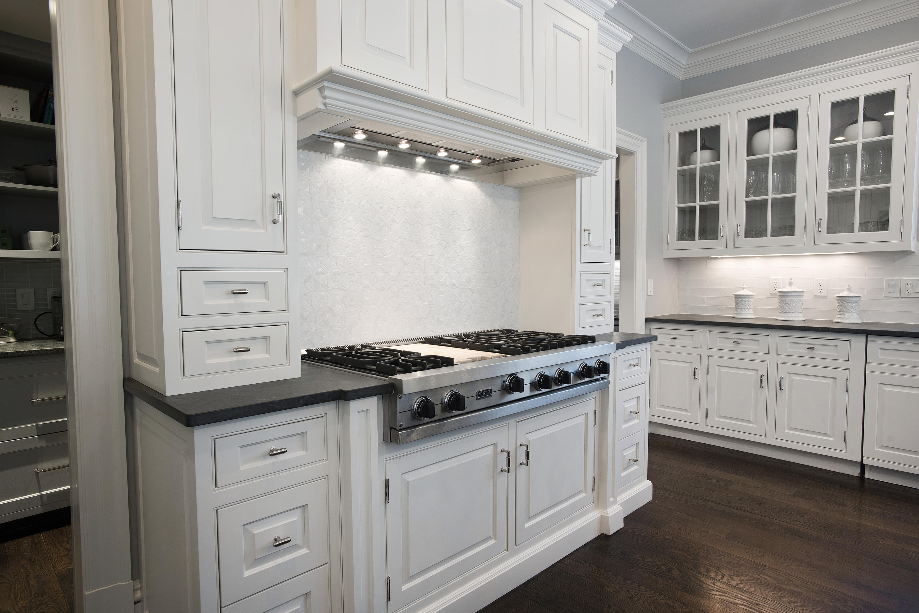 1629 Ponus Ridge Road New Canaan, CT 06840 - Photo 19 of 51 a kitchen with granite countertop white cabinets and a stove