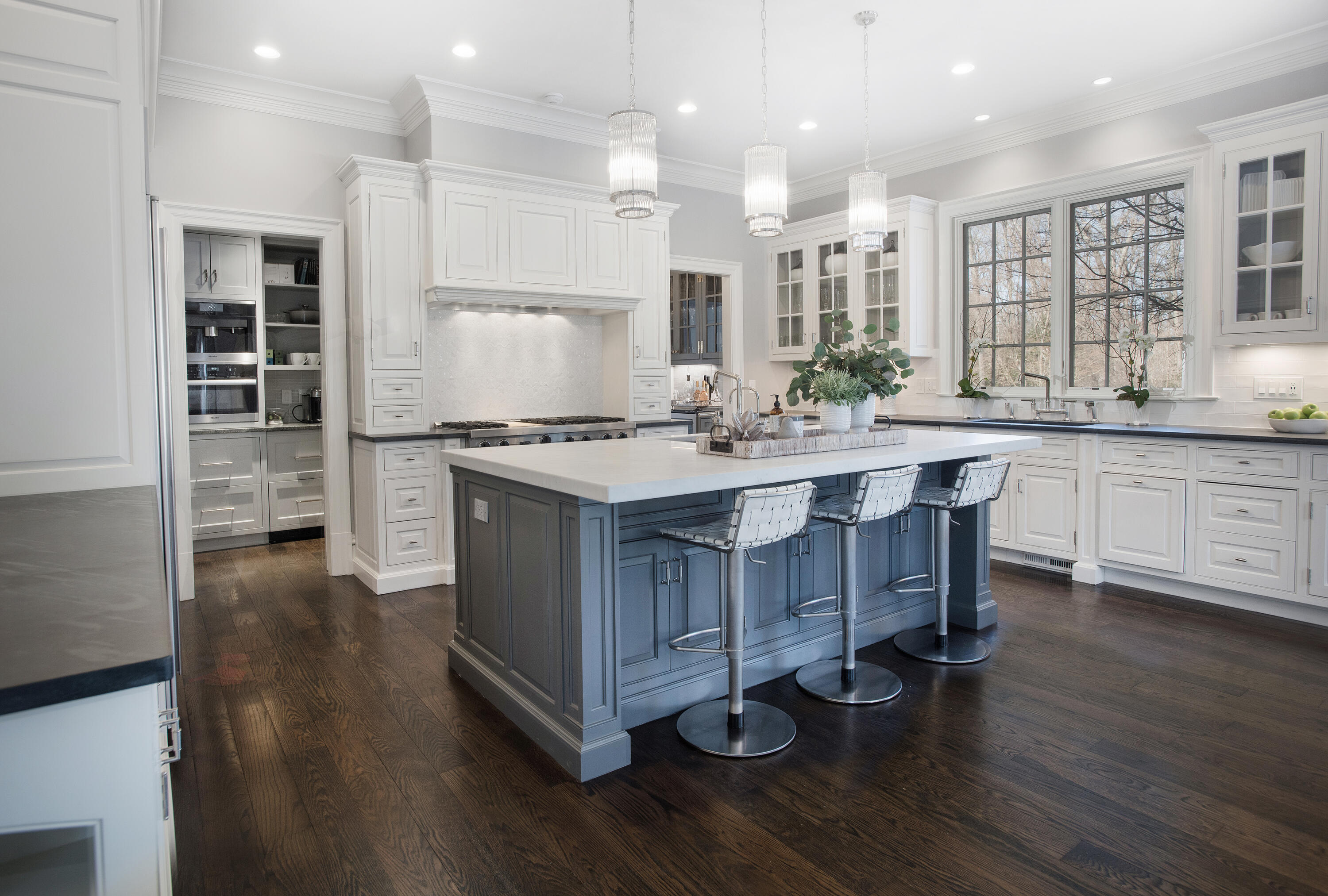 1629 Ponus Ridge Road New Canaan, CT 06840 - Photo 20 of 51 a kitchen with a sink cabinets and wooden floor