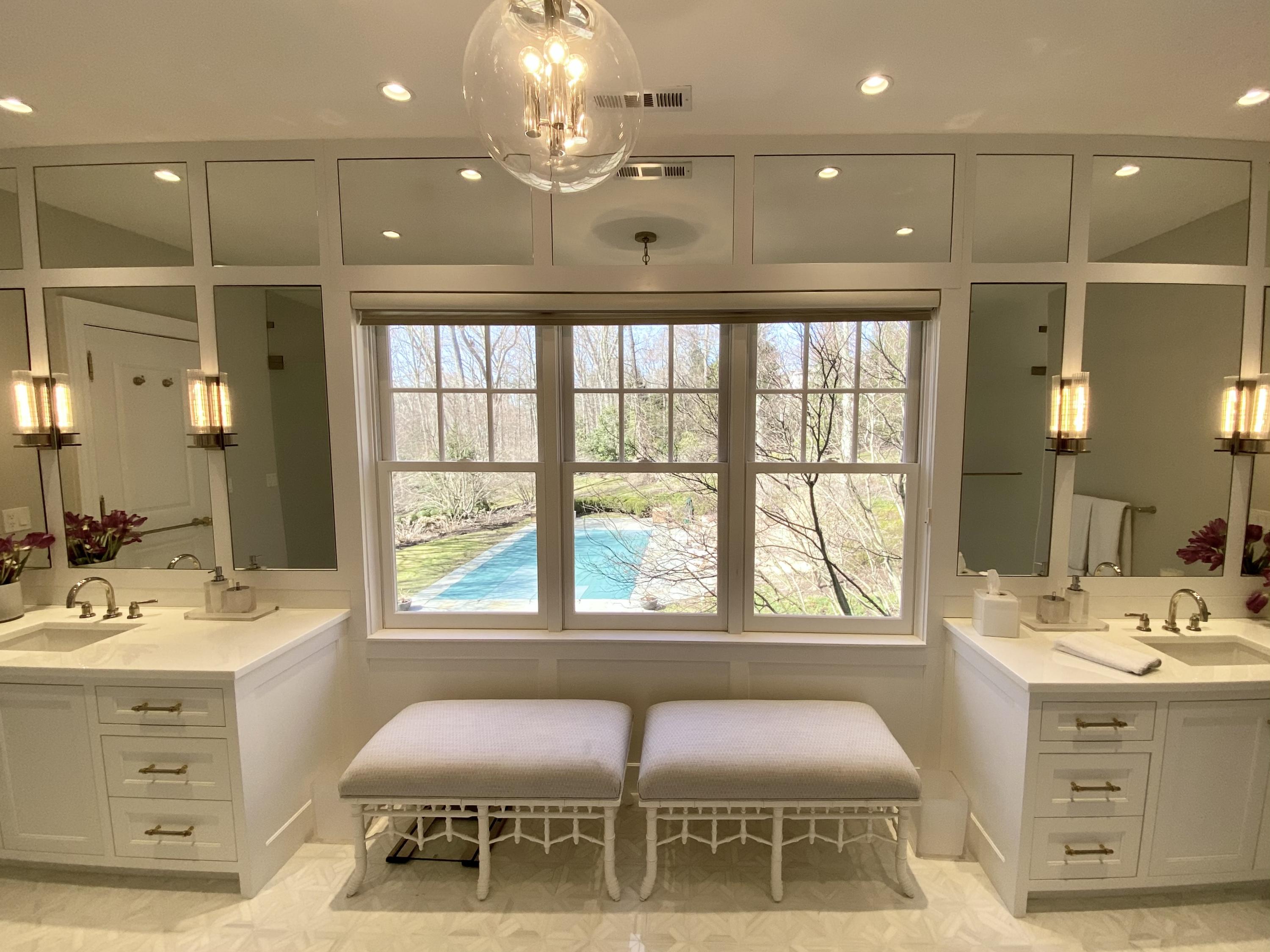 1629 Ponus Ridge Road New Canaan, CT 06840 - Photo 31 of 51 a bathroom with a sink vanity and mirror