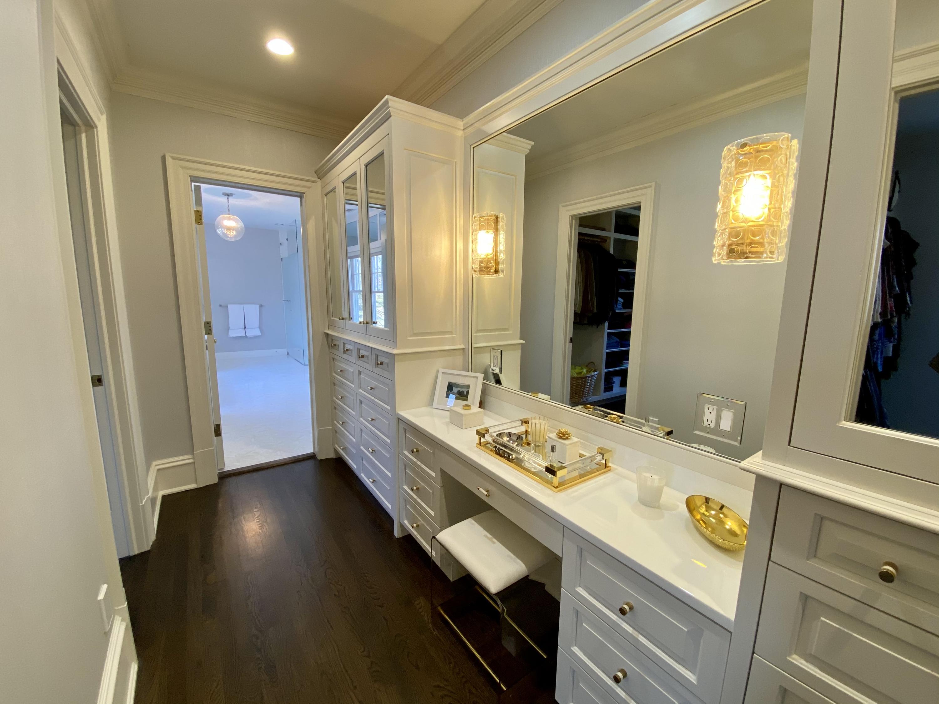 1629 Ponus Ridge Road New Canaan, CT 06840 - Photo 32 of 51 a bathroom with a sink and a mirror