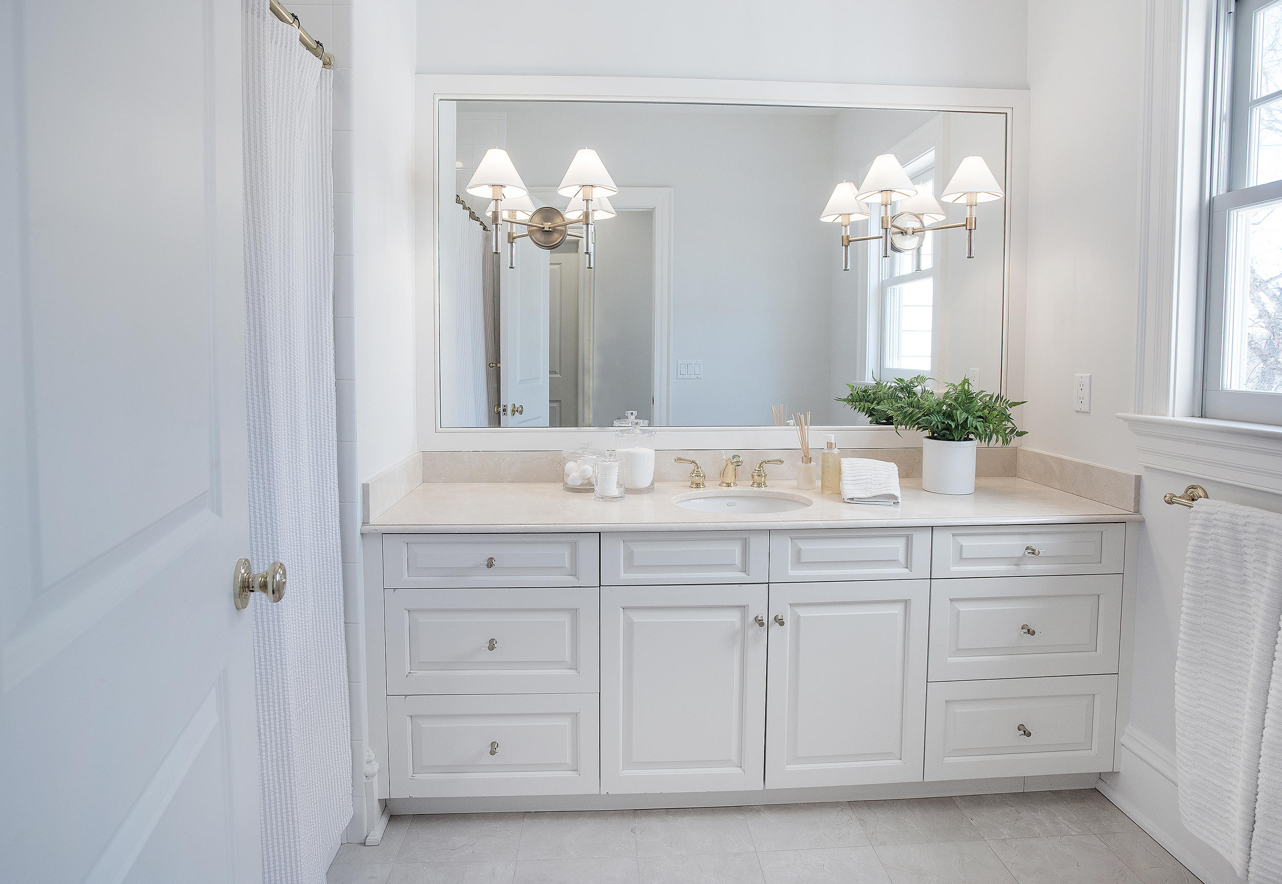 1629 Ponus Ridge Road New Canaan, CT 06840 - Photo 36 of 51 a bathroom with a sink vanity and a mirror