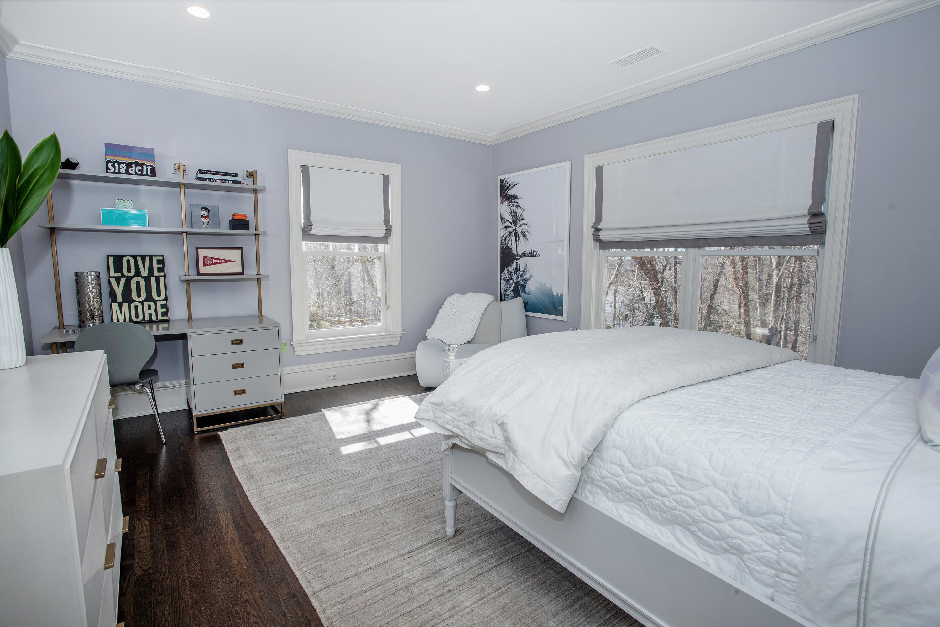 1629 Ponus Ridge Road New Canaan, CT 06840 - Photo 38 of 51 a bedroom with a bed and a bookshelf
