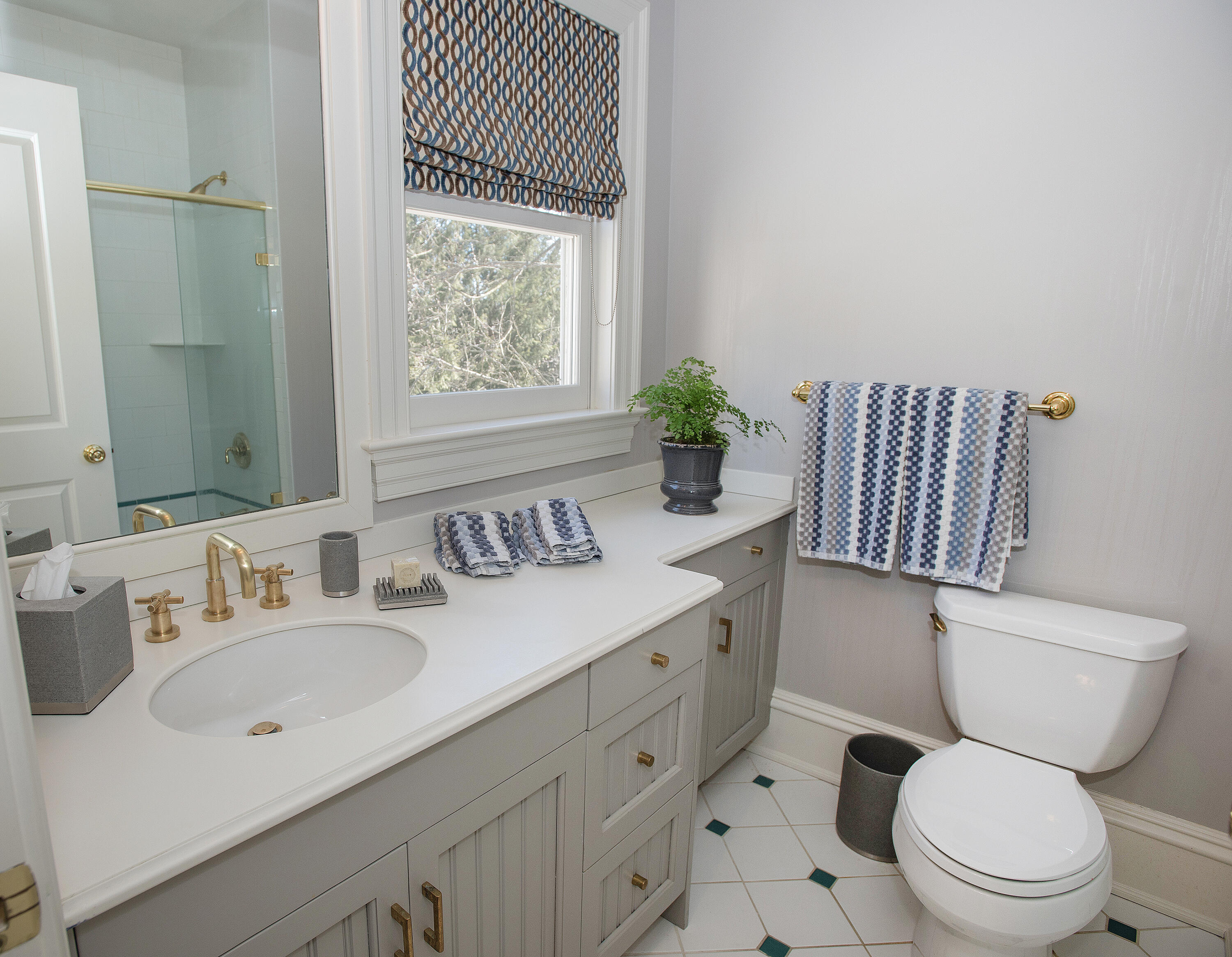 1629 Ponus Ridge Road New Canaan, CT 06840 - Photo 40 of 51 a bathroom with a toilet sink and mirror