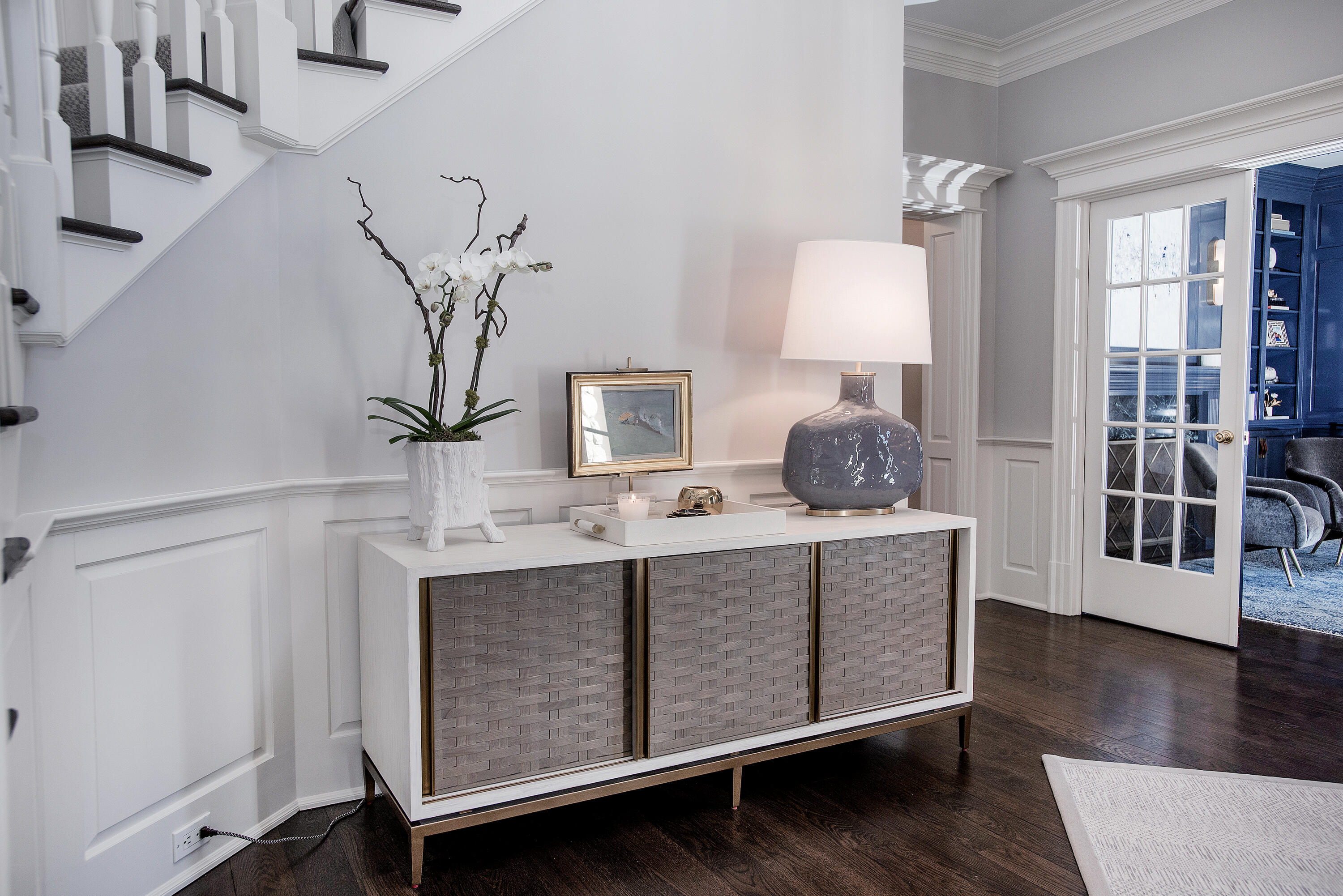 1629 Ponus Ridge Road New Canaan, CT 06840 - Photo 5 of 51 a room with a wooden floor and potted plant on a table