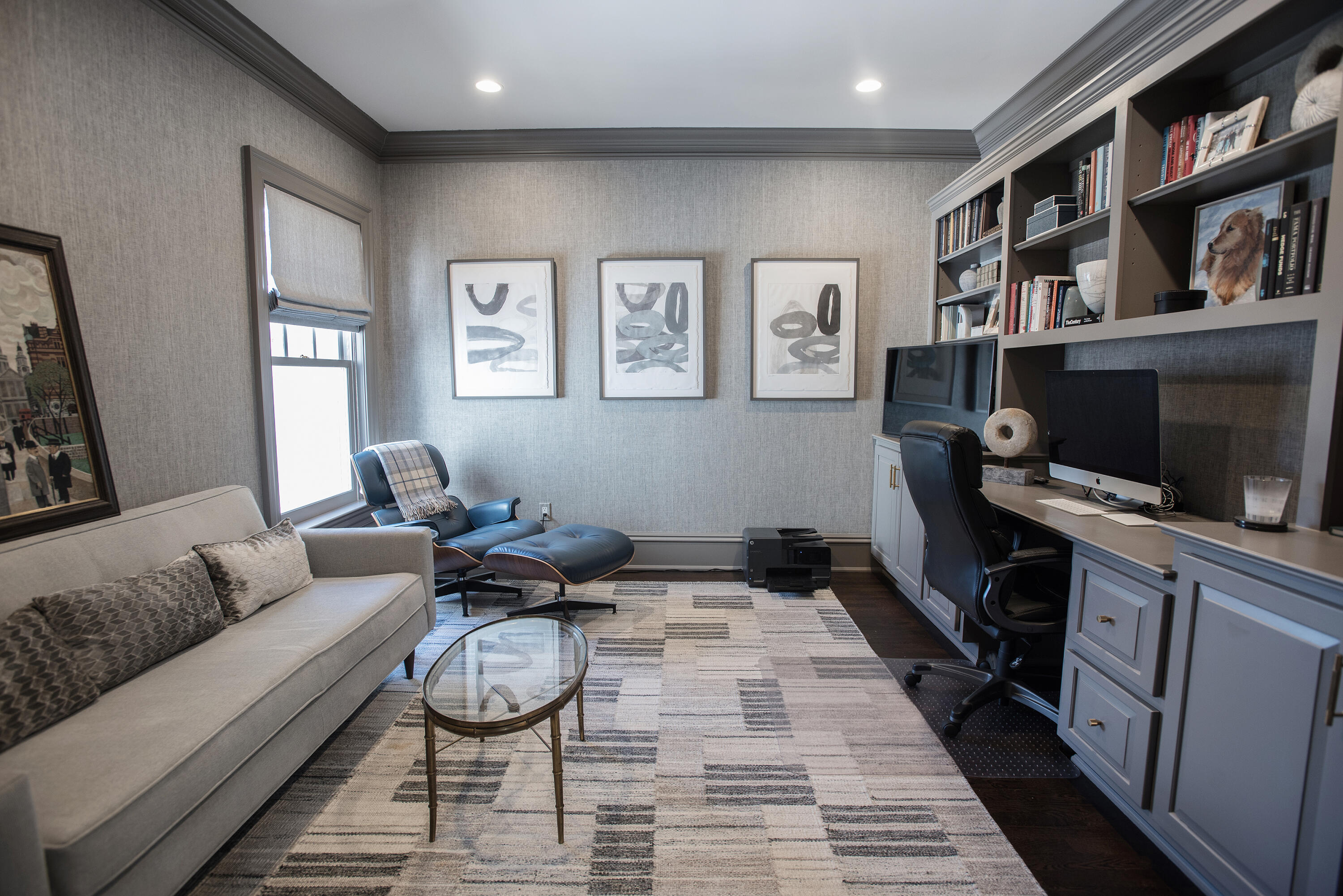 1629 Ponus Ridge Road New Canaan, CT 06840 - Photo 41 of 51 a living room with furniture a rug and a book shelf