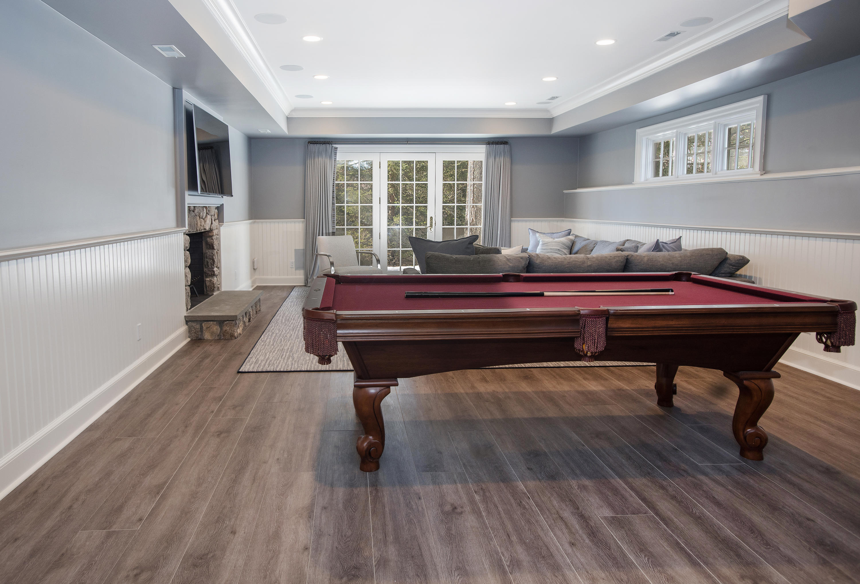 1629 Ponus Ridge Road New Canaan, CT 06840 - Photo 44 of 51 a room with wooden floor and furniture