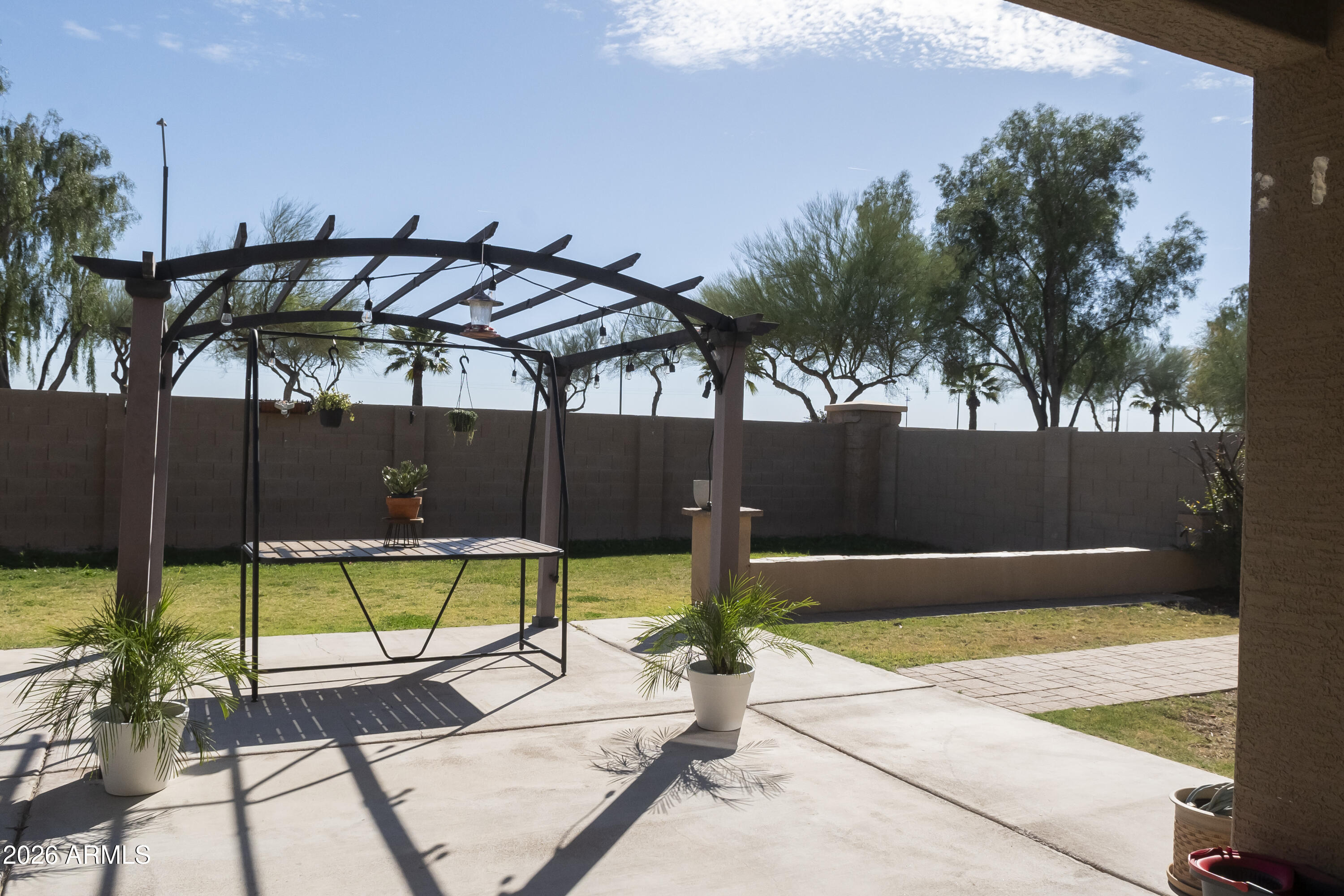 16045 West Almeria Road Goodyear, AZ 85395 - Photo 29 of 31 a view of swimming pool with chairs
