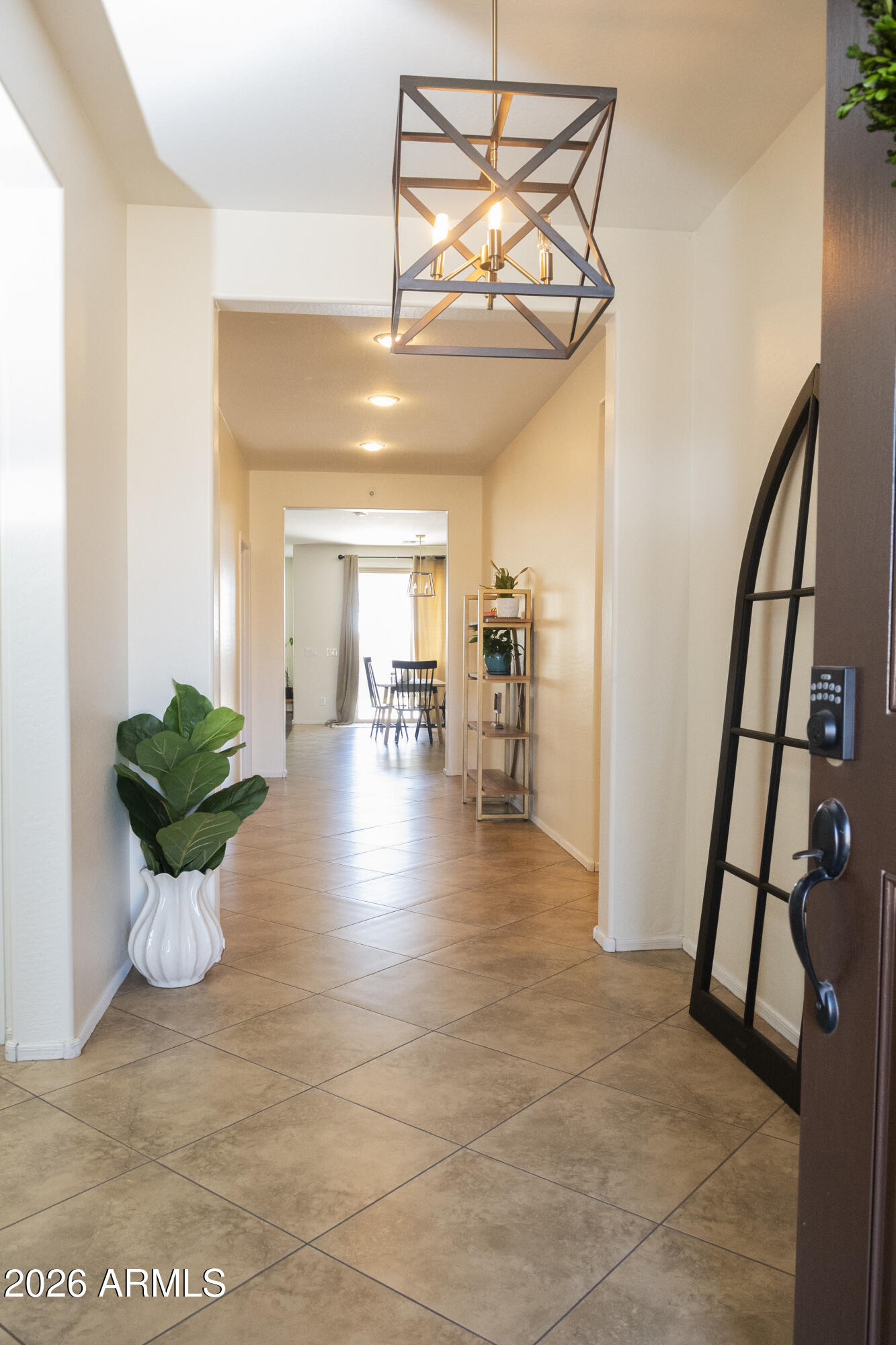 16045 West Almeria Road Goodyear, AZ 85395 - Photo 5 of 31 a view of an empty room and wooden floor