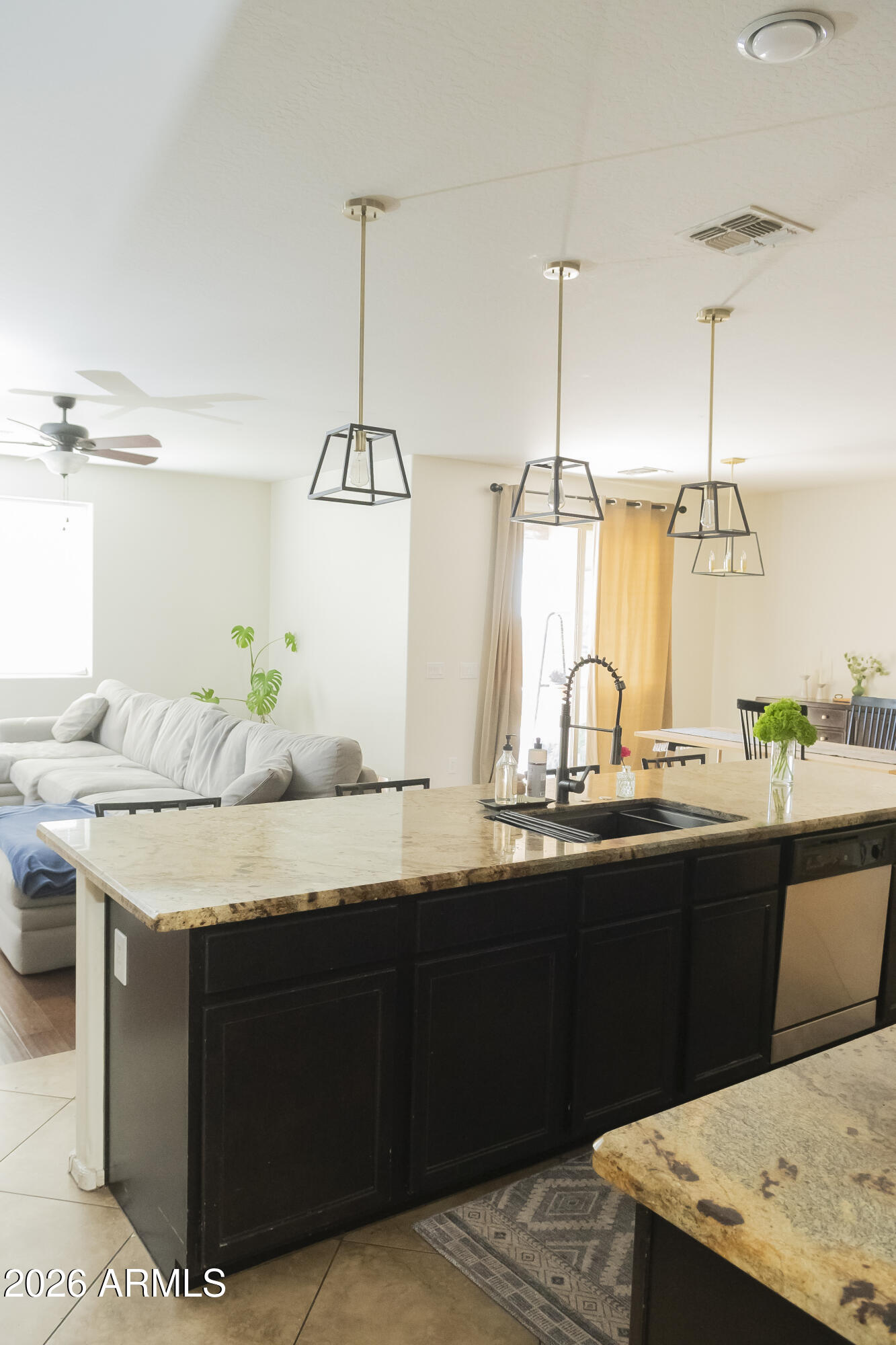 16045 West Almeria Road Goodyear, AZ 85395 - Photo 9 of 31 a kitchen with a sink and cabinets