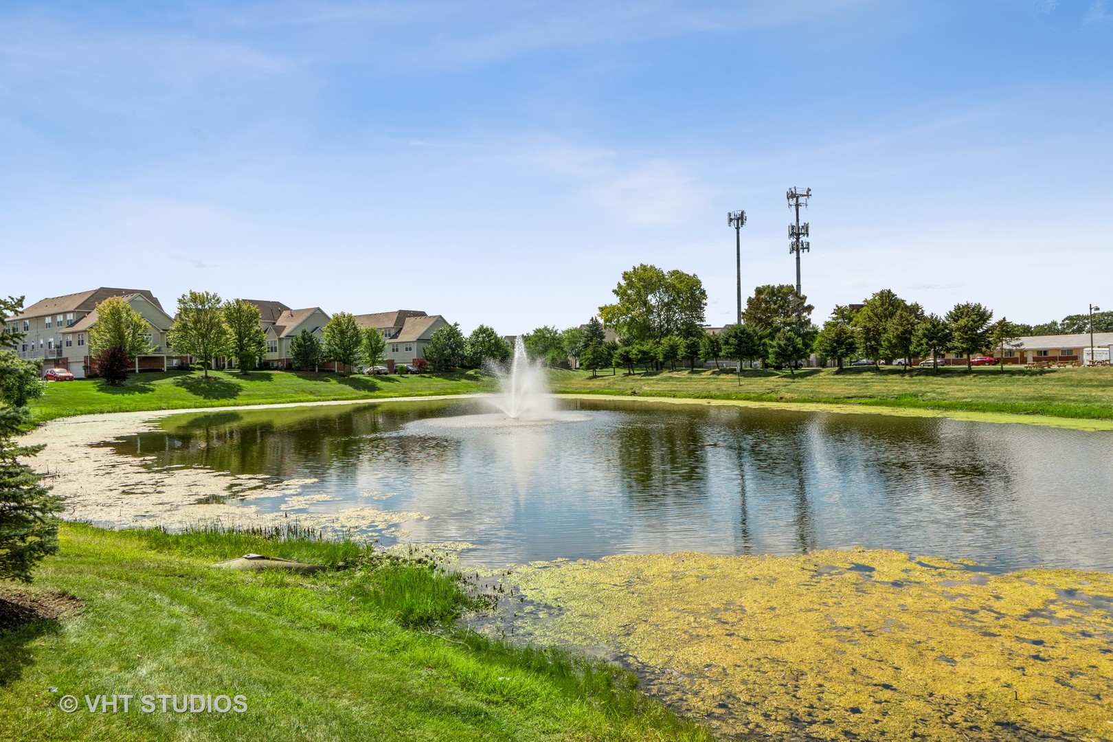 285 Timber Ridge Court Joliet, IL 60431 - Photo 21 of 21 a view of a lake with a building in the background